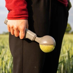 Kompact 9 Retractable Dog Ball Launcher -Pampered Paws product image in situ hold